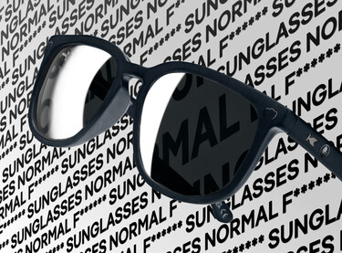 Knockaround sunglasses on a Normal F***ing Sunglasses backdrop